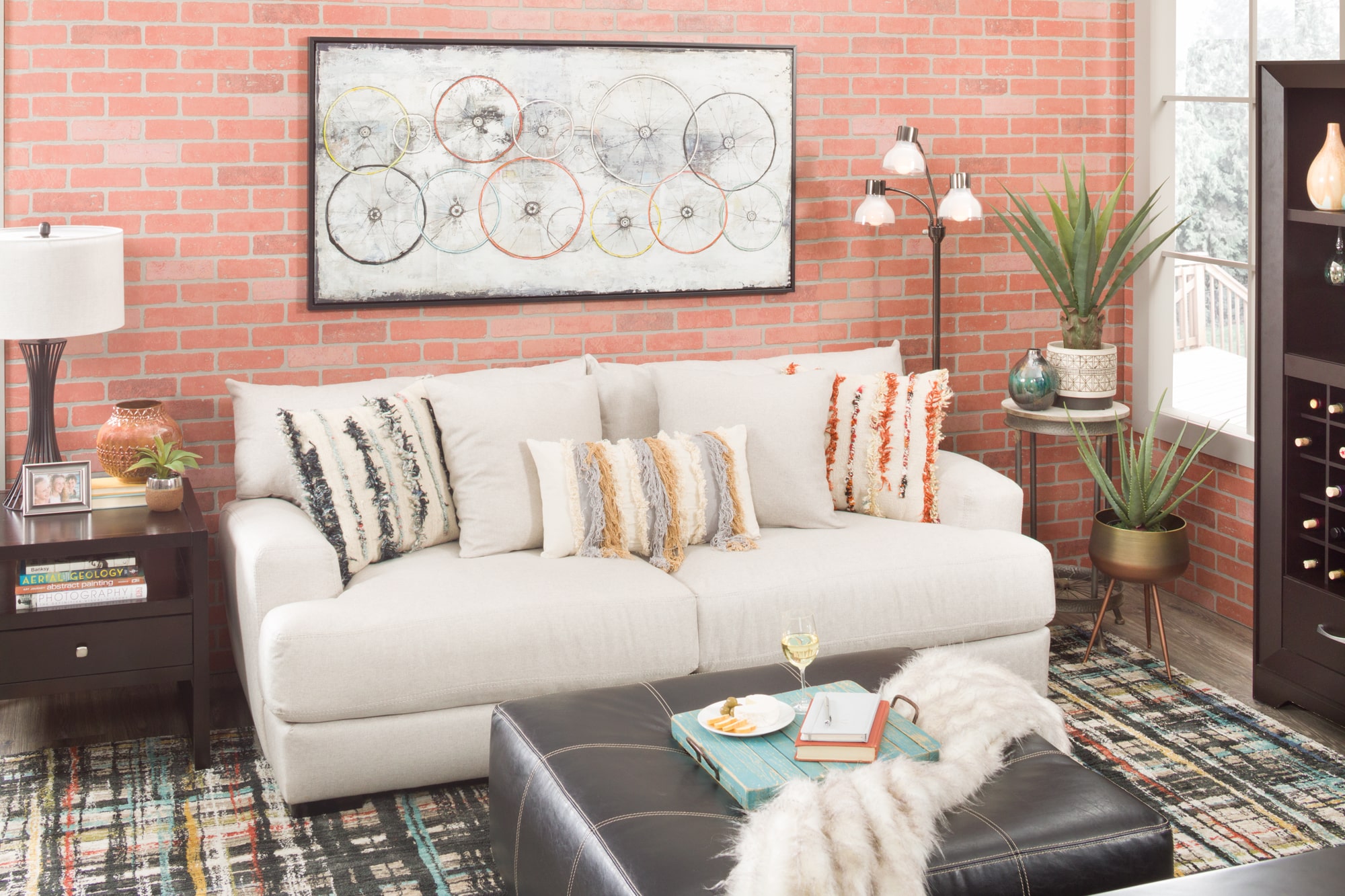 Cozy conversation area with sofa, ottoman, and rug