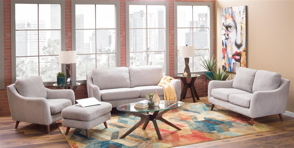 Living room with bold portait wall art and a mid century modern wood and glass cocktail table